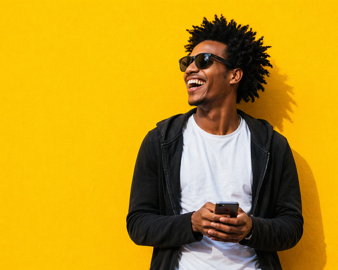 A smiling Paybee user holding a phone against a yellow background
