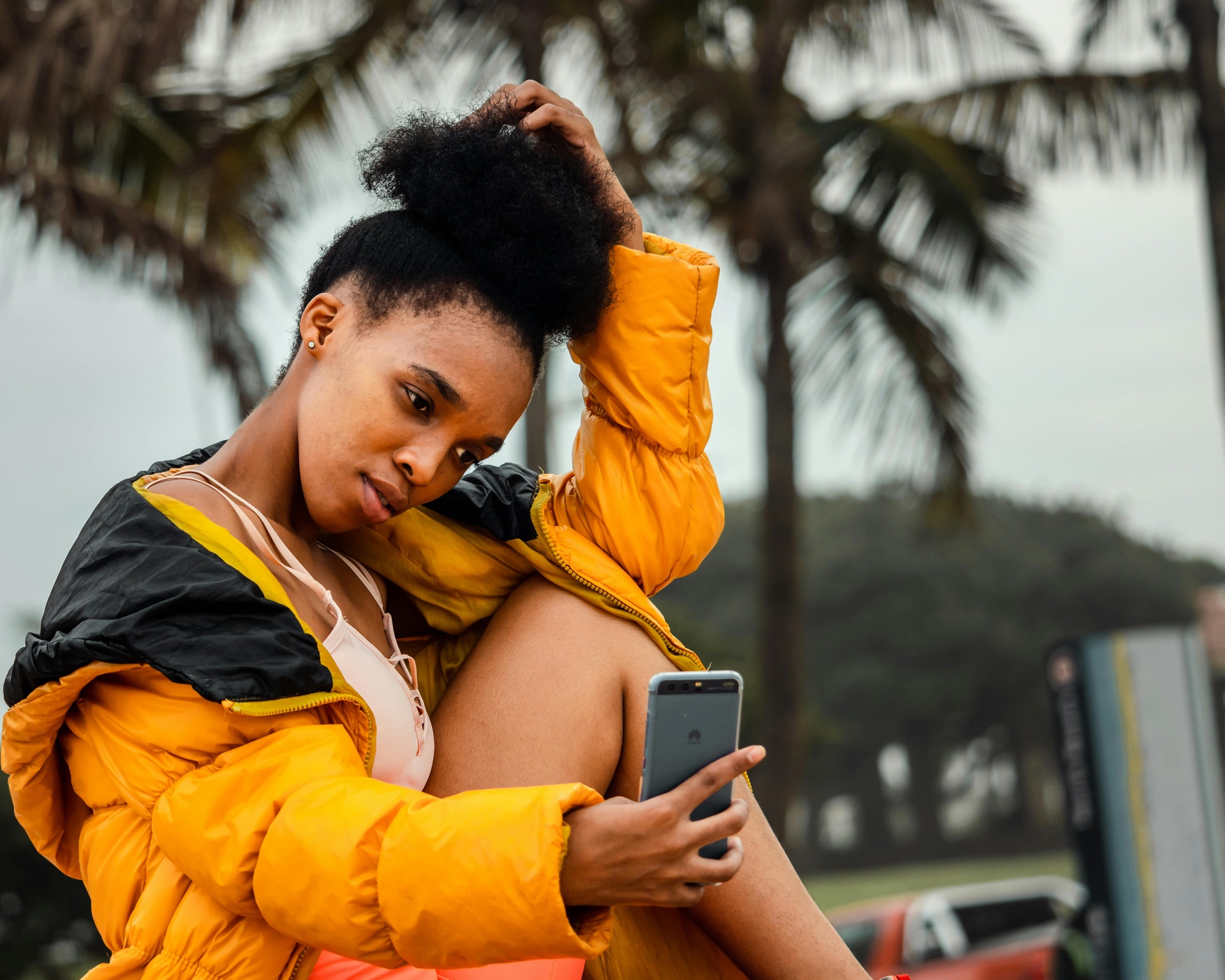 A Paybee user holding a smartphone outdoors